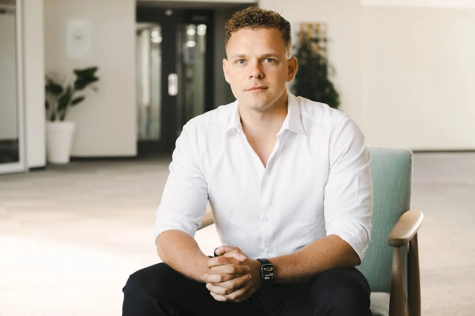 James de Villiers, Chief Executive Officer of Octoco, seated in a white shirt